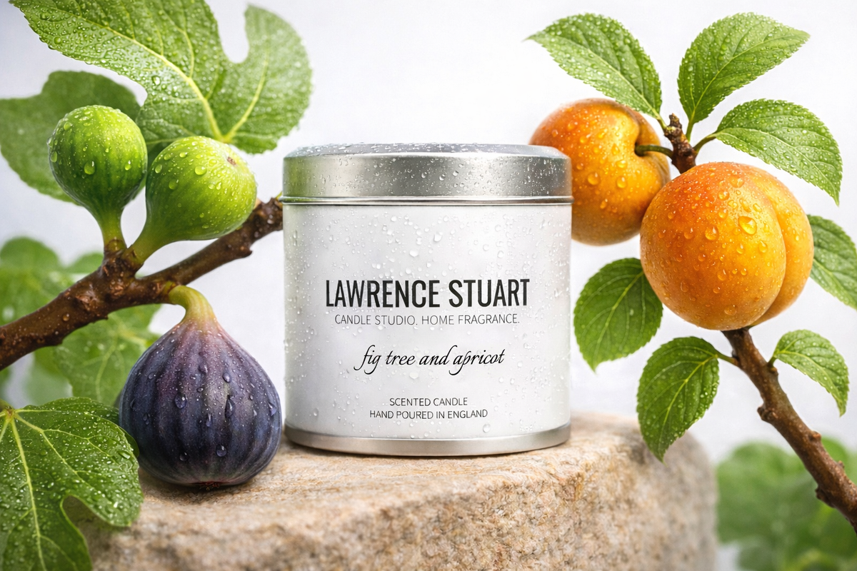 Lawrence Stuart candle displayed with figs, apricots, and leaves on a light background